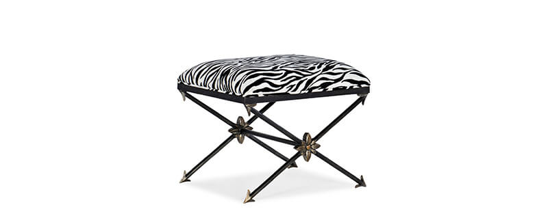 A metal bench with a zebra print fabric